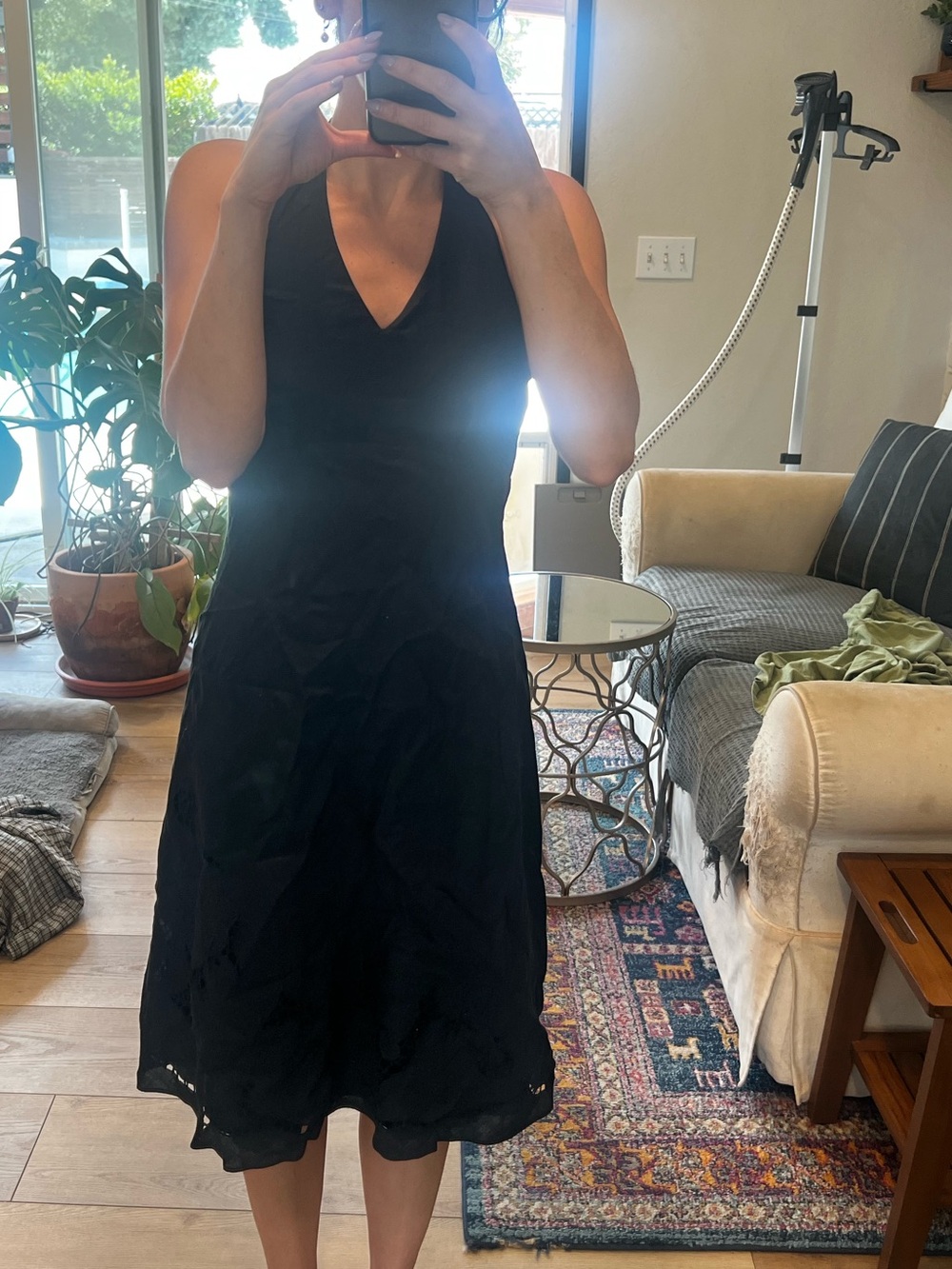 Ann Taylor LBD with halter neckline and cut out at bottom.